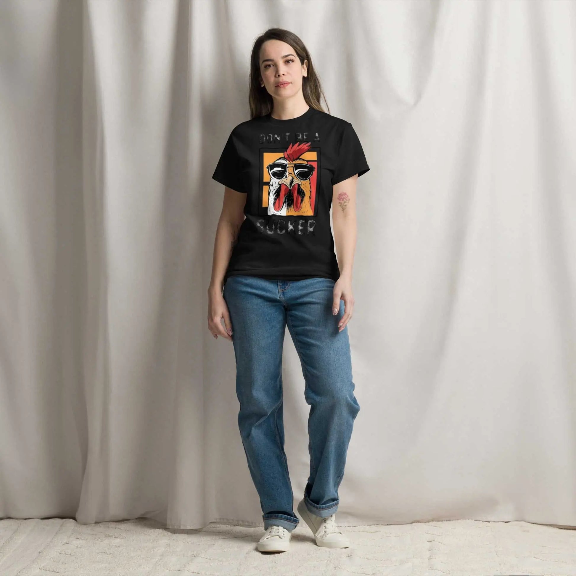 Bold, stylish custom graphic tee featuring "don't be a sucker" design on a classic black cotton shirt.