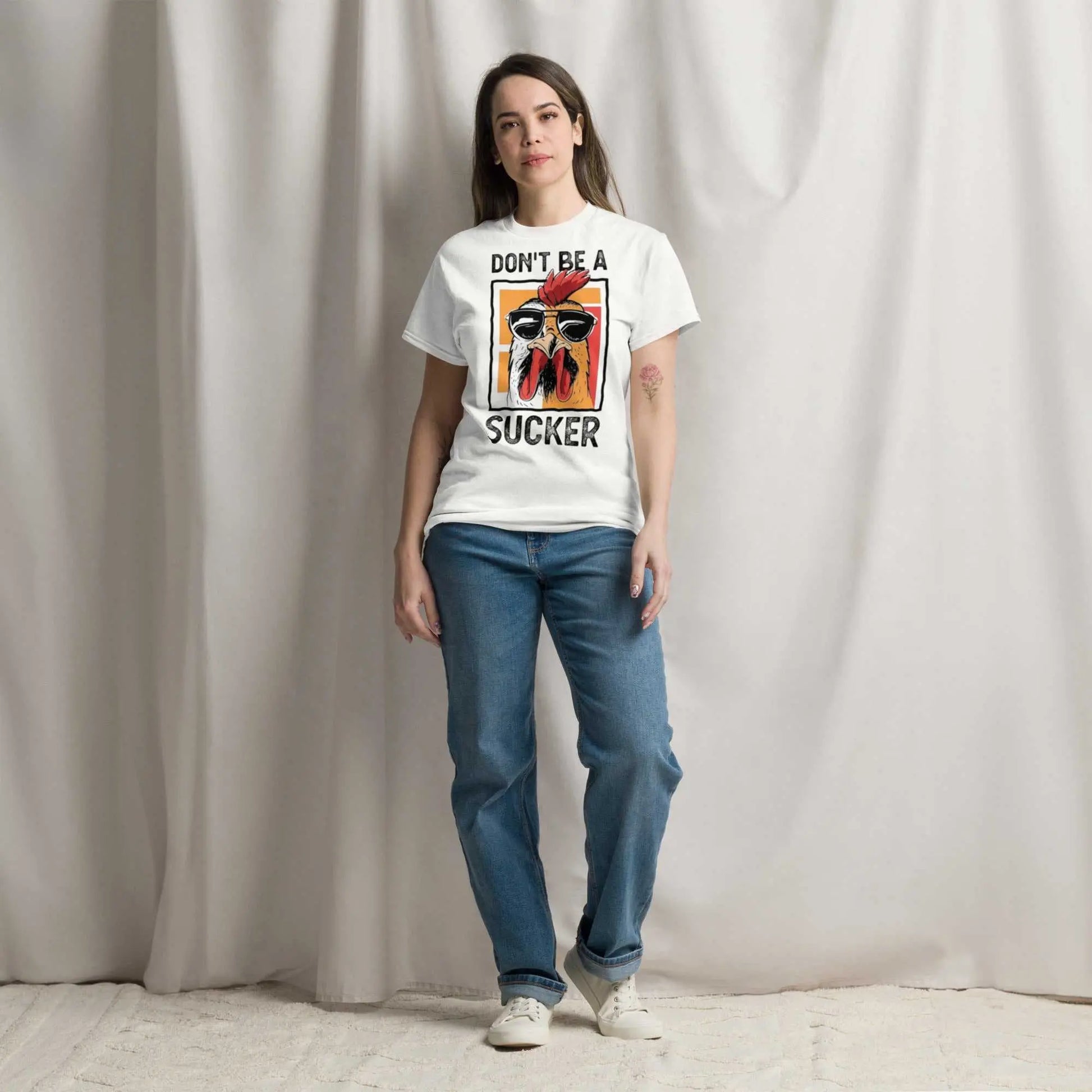 Bold stylish custom graphic tee with "Don't Be a Sucker" design, 100% cotton, unisex classic fit.
